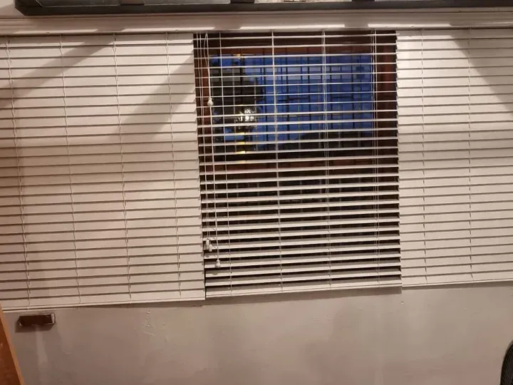White venetian blinds fitted in a Cape Town room
