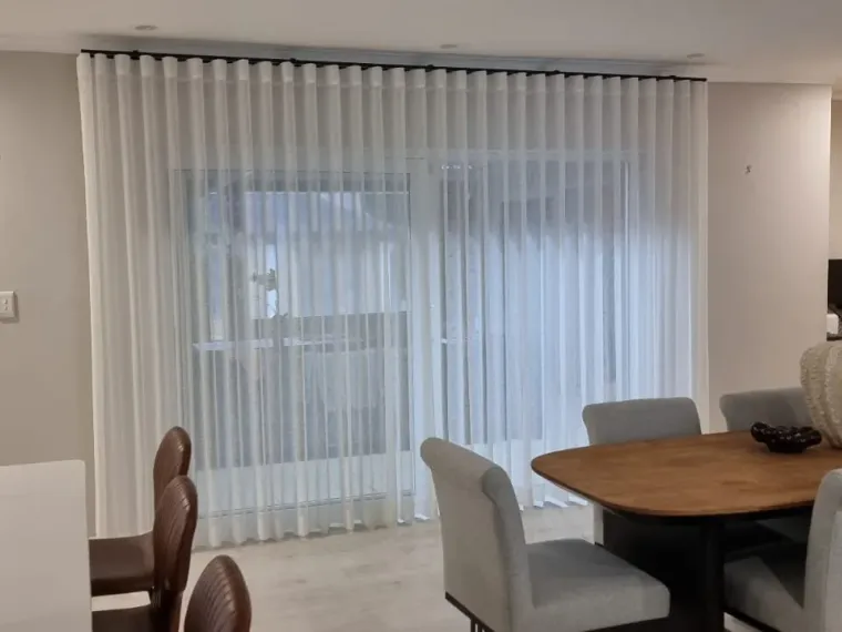 White sheer wave curtains in a Cape Town dining room