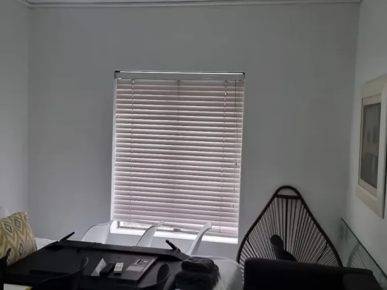 Beige venetian blinds on bedroom windows in Cape Town
