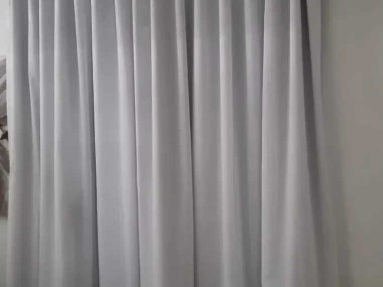 White wave curtains fitted floor to ceiling in a Cape Town bedroom