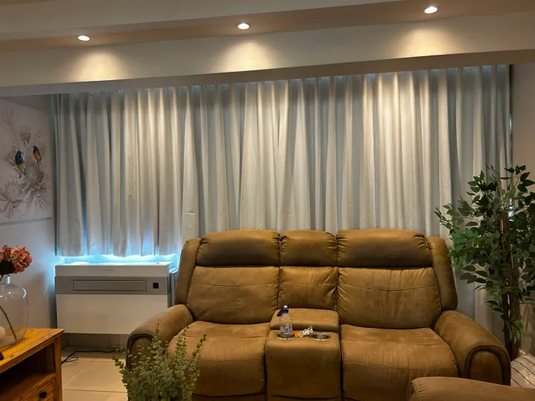 Silver-grey wave curtains in a Cape Town lounge